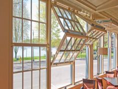 the inside of a restaurant with large windows