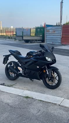 a black motorcycle is parked on the street