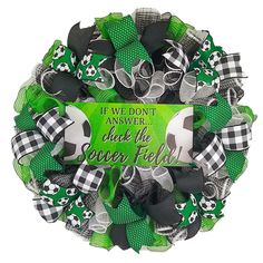 a green and black soccer wreath with the words, if we don't answer think the soccer field