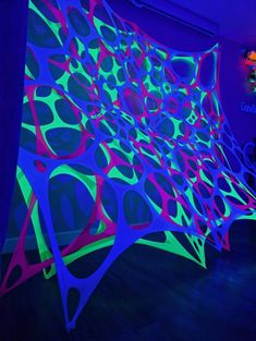 an art installation with neon colors on the walls