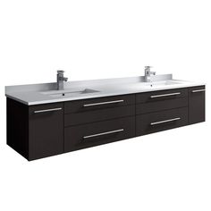 two sinks are shown in front of a white wall and dark wood cabinets with chrome handles