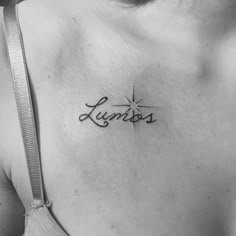 a black and white photo of a woman's chest with the word lumos on it