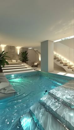 an indoor swimming pool with steps leading up to it