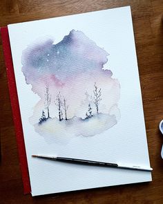 a watercolor painting of some trees on a table next to paintbrushes and markers