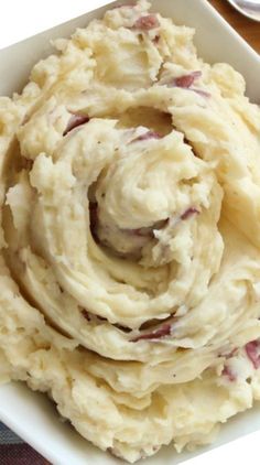 mashed potatoes in a square white bowl