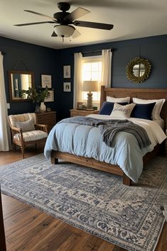 a bedroom with blue walls and wooden furniture, including a large bed in the center