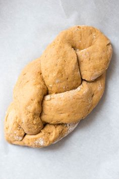 a close up of a doughnut on wax paper