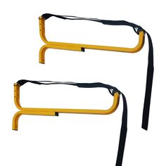 two yellow metal barricades with black straps