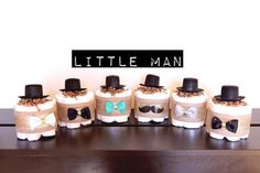 a group of little man cakes sitting on top of a table