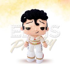 a crocheted elvis presley doll is shown in front of a yellow and white background