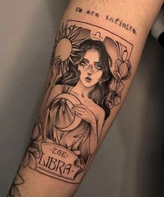 a woman's arm with a tattoo on it