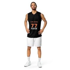 a man wearing a jersey with the number twelve on it and standing in front of a white background