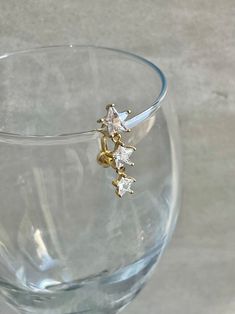 a close up of a wine glass with a gold ring on it's side