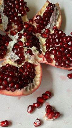 the pomegranate is cut in half and ready to be eaten