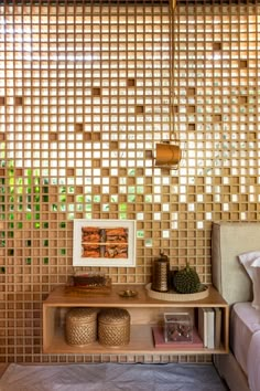 a bed room with a neatly made bed next to a window covered in bamboo blinds