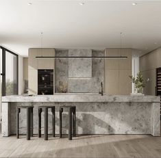 a large kitchen with marble counter tops and bar stools in the middle of it