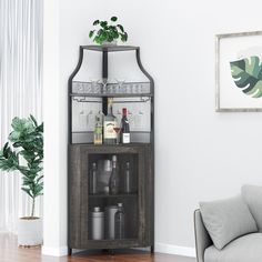 a living room with a couch, chair and wine glass case in the corner on the wall