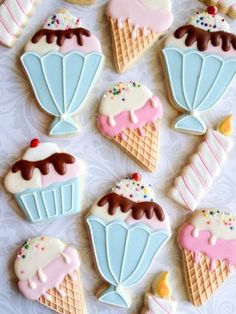 decorated cookies are arranged in the shape of ice cream cones