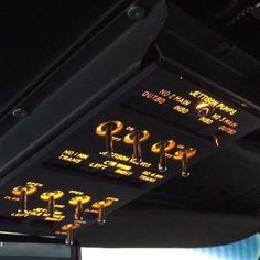 the control panel in an airplane is lit up with yellow lights and numbers on it