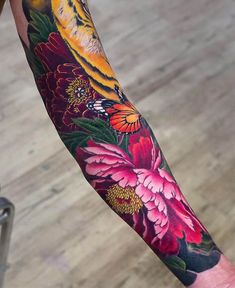 a person with a colorful tattoo on their arm