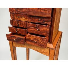 a wooden dresser with drawers on top of it