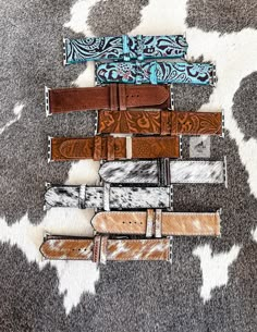 These are our genuine leather watch bands. Choose from 38/40mm or 42/44mm. Compatible with Apple iWatch.  *Note for the cowhide bands: Because these are genuine cowhide no 2 bands will be alike. You will receive a variation of the style you choose. Please message us if would like to see the current options. Click here to be taken to our other bracelets: https://www.etsy.com/shop/CactusAndCoralInc?section_id=12465580 Click here to be taken to our Western chokers: https://www.etsy.com/shop/CactusAndCoralInc?section_id=39808176 Join us to be notified of new releases and exclusive discounts!  https://linktr.ee/cactusandcoral Thank you for stopping by. Have a blessed day! Sincerely, The Cactus and Coral Crew Apple Watch Bands Women Western, Apple Watch Bands Western, Western Watch Bands, Western Apple Watch Bands, Western Apple Watch Band, Country Girl Accessories, Western Chokers, Western Apple Watch, Tooled Leather Phone Case