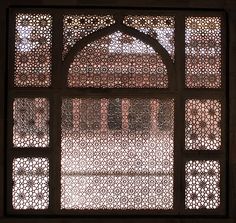 an ornate window in the middle of a building