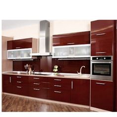 a kitchen with wooden floors and brown cabinets