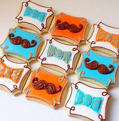 decorated cookies in the shape of mustaches and bow ties