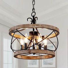 a wooden chandelier hanging from a ceiling