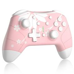 a pink controller with white flowers on it