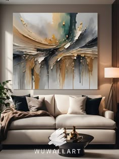 a living room scene with focus on the couch and large painting hanging over the coffee table