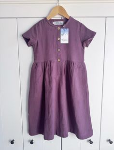 Long  dress made of high quality double gauze fabric. Front fastening with cocounut buttons. Side pockets.  Loose fit. You can buy the same women's dress here:  https://www.etsy.com/pl/listing/1164101952/woman-muslin-dress-caramel-colour?click_key=440e011542ecb71eeeaa37d9a30b84f461acfaab%3A1164101952&click_sum=d504f585&ref=shop_home_active_8&crt=1&sts=1 Size 3 bust 22", waist 20 1/2", hip 23" bust 55,5cm, waist 52cm, hip 58,5cm Size 4 bust 23", waist 21", hip 24" bust 58,5cm, waist 53cm, hip 61c Double Gauze Dress, Muslin Dress, Grape Color, Double Gaze, Double Gauze Fabric, Gauze Dress, Gauze Fabric, Caramel Color, Double Gauze