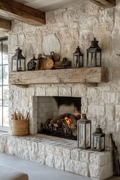 a stone fireplace with lots of lanterns on it