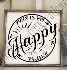 this is my happy place sign with the words in black and white, on a shelf