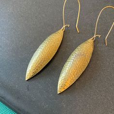 Elegant Textured Brass Jewelry, Elegant Hammered Bronze Earrings, Oval Hammered Brass Jewelry, Traditional Brass Hammered Earrings, Artisan Gold Oval Earrings, Bronze Hammered Teardrop Jewelry, Hammered Teardrop Bronze Jewelry, Hammered Bronze Teardrop Jewelry, Bronze Hammered Teardrop Earrings