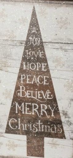 a wooden sign with the words merry christmas written on it and a tree in the middle