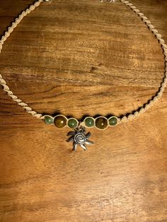 Elevate your style with the handmade hemp macrame spiral sun choker necklace! 🌿 This stunning piece is intricately crafted with love and positive energy, making it a unique accessory that will add a touch of bohemian charm to any outfit. 💫 Perfect for those who appreciate the art of handcrafting and sustainable fashion. ♻️ So go ahead, embrace your inner goddess and shine bright like the sun with our one-of-a-kind choker. Handmade Bead Necklaces, Granola Jewelry, Hippie Jewelry Aesthetic, Necklaces Hippie, Sun Choker, Spiral Knot, Hemp Choker, Spiral Sun, Hippie Sun