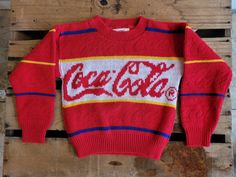 This Coca-Cola sweater is a rare piece of vintage Coke memorabilia. In excellent condition with a very cool textured finish where you can see Coca-Cola in raised letters along the red stripes. Bright and cheerful little sweater which would make a cool throw pillow, would fit a large teddy bear, or you could even put it on your kid! No holes or damage, very little pilling. See photos for measurements Please use coupon code LocalPickup at checkout to remove shipping fees and pick up in store in To Large Teddy Bear, Silly Clothes, Vintage Coke, Raised Letters, Vintage Coca Cola, Coca Cola Vintage, Online Thrift, Knitting For Kids, Coca Cola