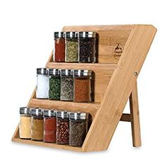 a wooden spice rack with spices on it