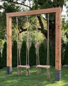 an outdoor swing set in the grass