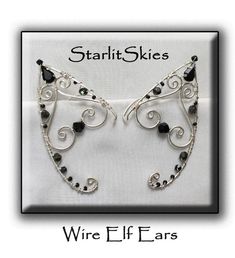 This Pair of Handcrafted Ear wraps has been created using Sterling Silver Wires, with Black Swarovski Crystals, and Hematite stone beads. Many colors available at check out. They are Comfortable and easy to wear with a Hoop on the back making it easy to adjust; Perfect for any Festive event, Cosplay, or night out on the Town. All Items are made to order. If you have something Special in mind… Please Contact us… We Love Custom Orders. Wire Elf Ears, Wire Crown, Ear Cuff Chain, Elven Jewelry, Elf Ears, Chain Maille Jewelry, Tin Man, Necklace Craft, Work Jewelry