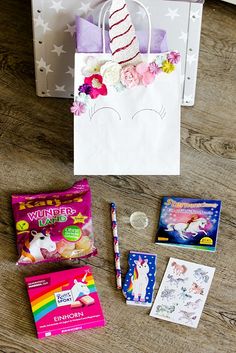 the contents of a unicorn themed birthday bag