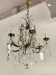 a chandelier hanging from the ceiling in a room