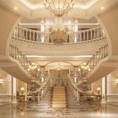 an elegant staircase with chandelier and marble flooring in a luxurious house or hotel