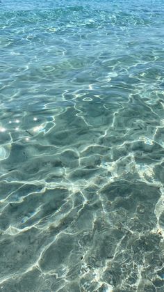 the water is very clear and blue with little ripples on it's surface