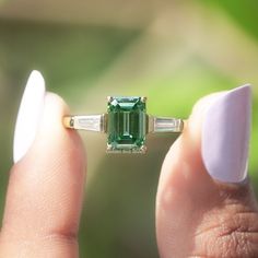 Emerald Cut Moissanite Ring | This 1.75 Ct Dark Green Moissanite Wedding Ring Features A Captivating Three-Stone Design With Tapper Baguette Moissanite Stones | Handcrafted With Love, This Exquisite Bridal Ring Is The Perfect Choice For Your Special Day.  ✥ 𝐅𝐢𝐧𝐝 𝐭𝐡𝐞 𝐦𝐚𝐭𝐜𝐡𝐢𝐧𝐠:  Band: https://www.etsy.com/listing/1226040576 ✥ 𝐌𝐚𝐢𝐧 𝐒𝐭𝐨𝐧𝐞 𝐃𝐞𝐭𝐚𝐢𝐥𝐬:  ↣ Shape:  Emerald  ↣ Type: Moissanite ↣ Weight: 1.75 CT (App.) ↣ Color/Clarity: Dark Green/VS ↣ Making Process: Handmade - Vvs Jewelry, Emerald Cut Moissanite Ring, Green Moissanite, Ring Three Stone, Emerald Cut Moissanite, Three Stone Engagement Ring, Moissanite Wedding Ring, Jewelry Details, Moissanite Wedding Rings