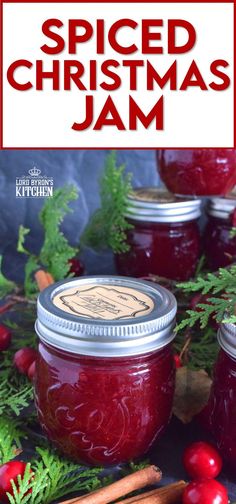 homemade spiced christmas jam in jars with cinnamon sticks and cranberries on the side