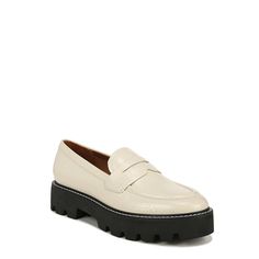 a women's white loafer with black soles