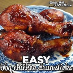 chicken drums on a blue and white plate with the words easy bbq chicken drums